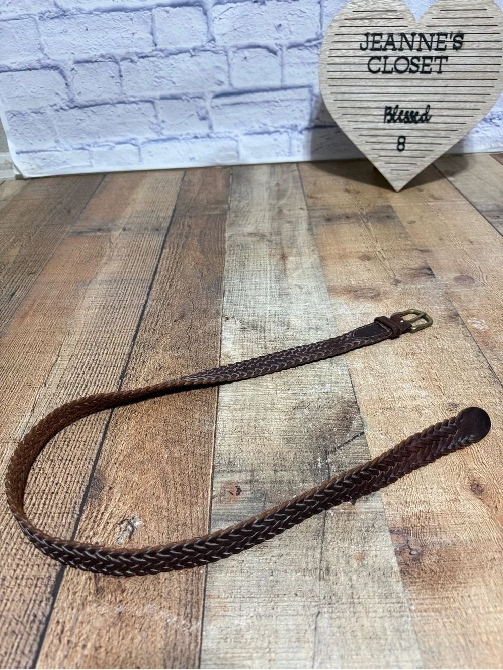 Brown leather braided belt size 31 with brass buckle